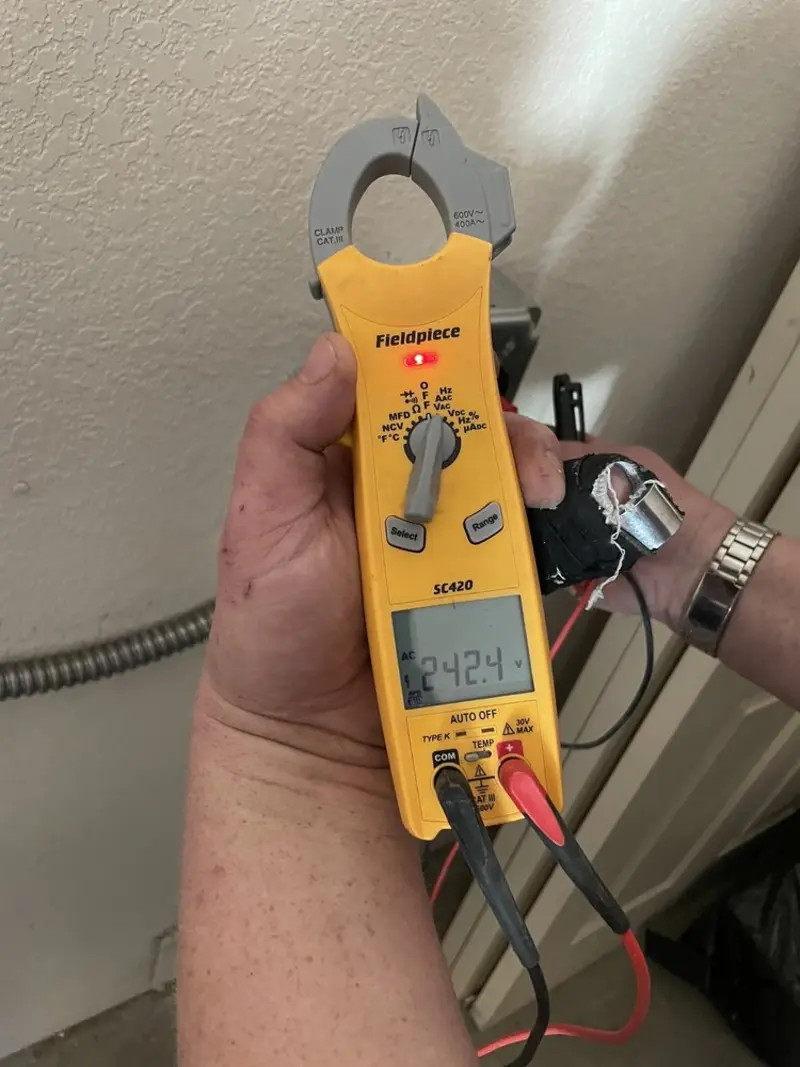 Voltage testing with clamp meter during Aluminum Wiring Replacement in Mena